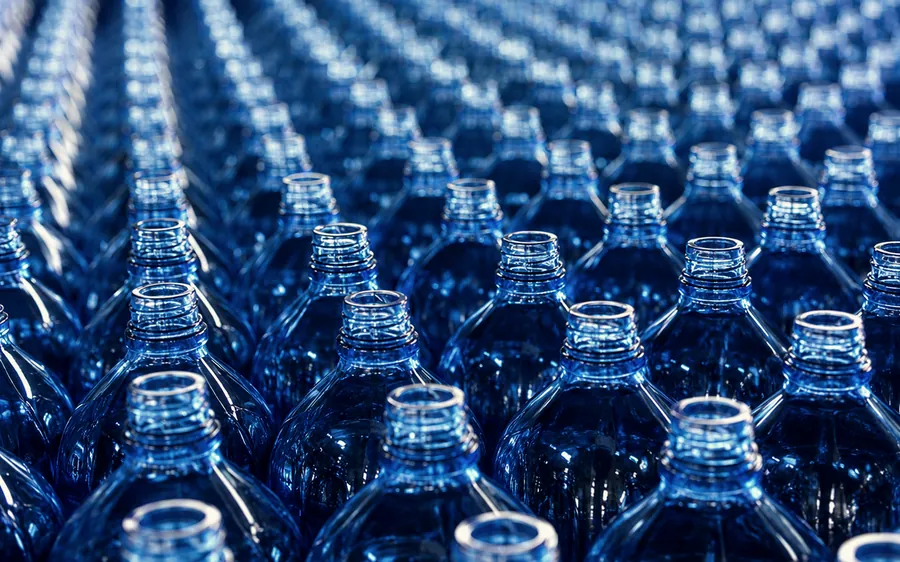 Close view of bottle neck finishes arranged in production